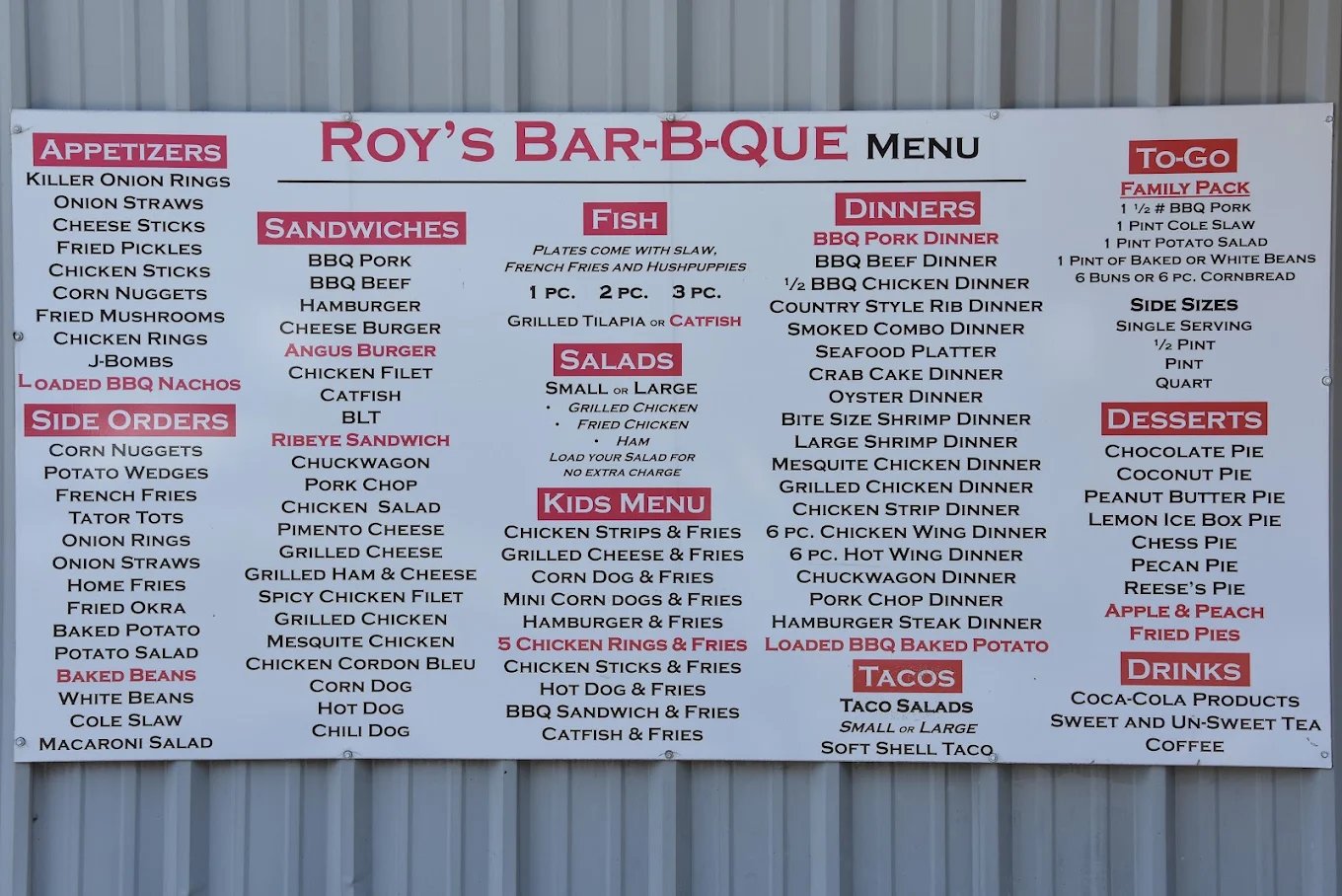 Roy's Bar-B-Que menu board listing sandwiches, dinners, sides and desserts
